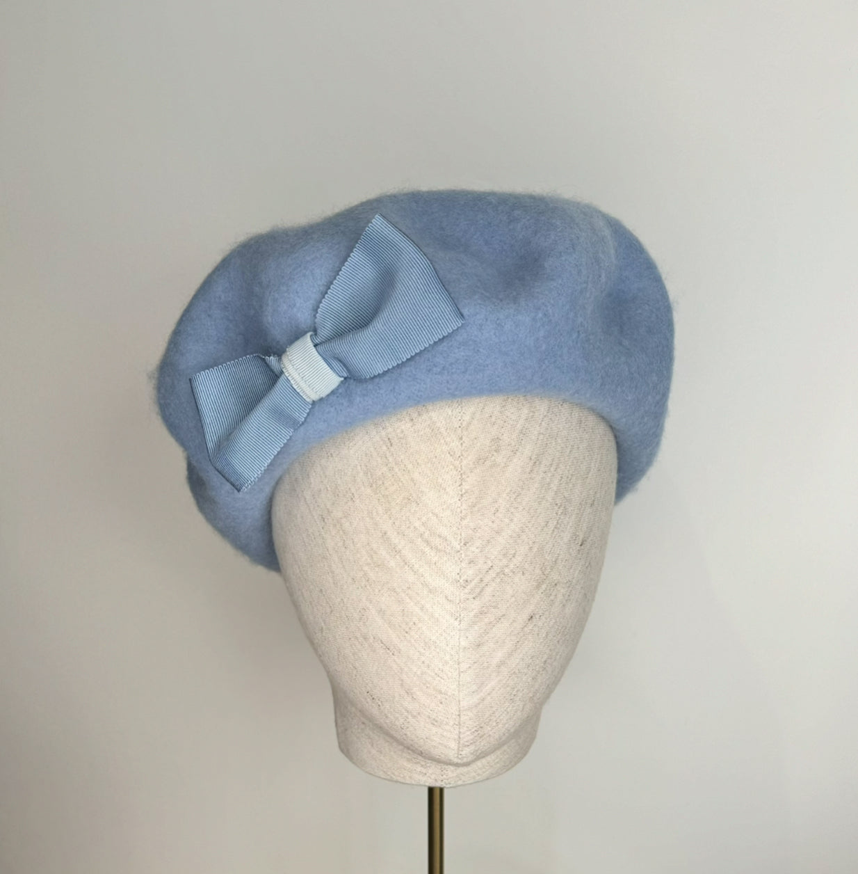 Pale blue beret with bow