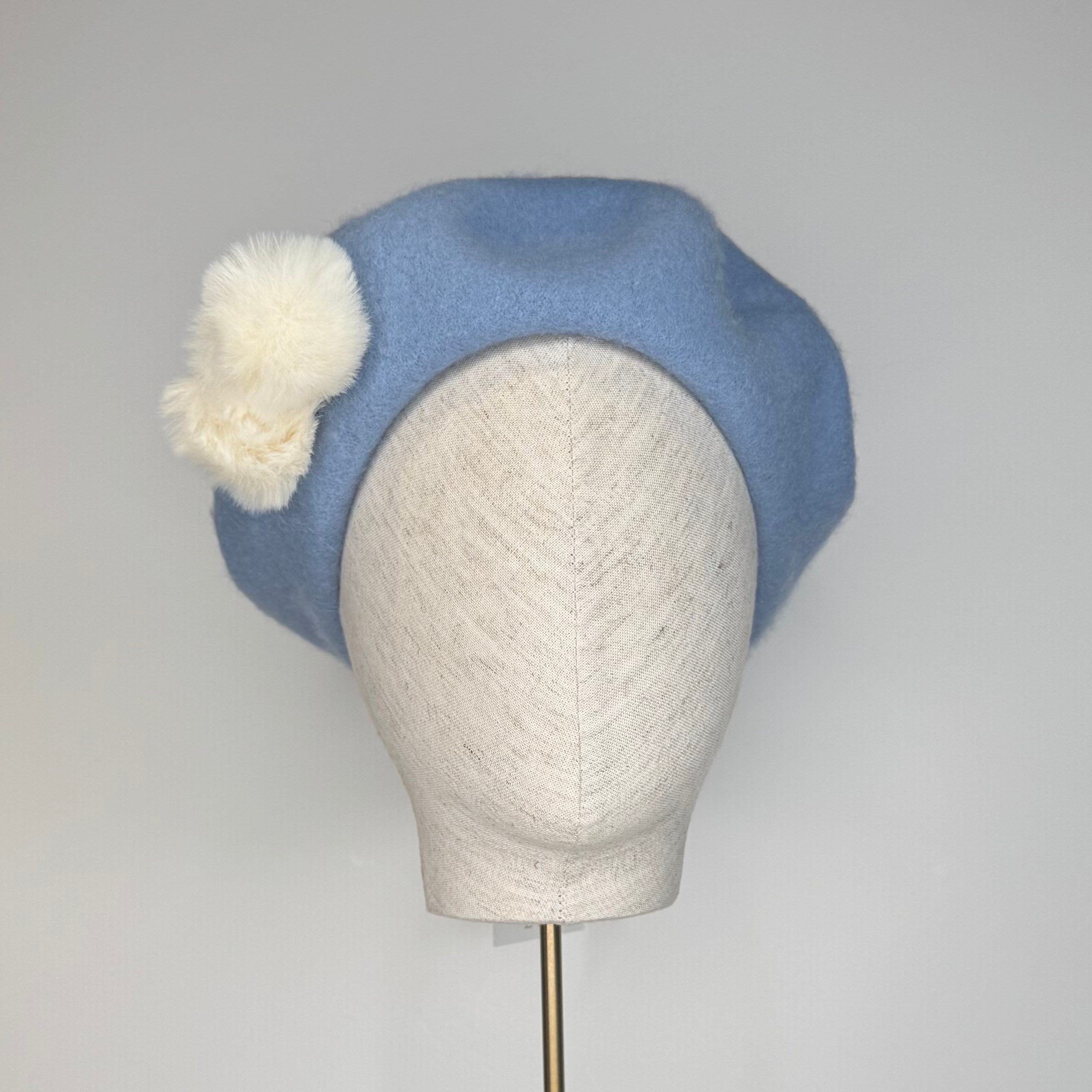 Sky blue beret with Pom poms